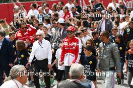 (L to R): Bernie Ecclestone (GBR) CEO Formula One Group (FOM) with Fernando Alonso (ESP) Ferrari and Lewis Hamilton (GBR) Mercedes AMG F1 at a FIA Safe Roads display with F1 personnel. 12.05.2013. Formula 1 World Championship, Rd 5, Spanish Grand Prix, Barcelona, Spain, Race Day