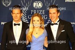 (L to R): Sebasiten Ogier (FRA) WRC World Champion, with his girlfriend Andrea Kaiser and his Co-Driver Julien Ingrassia (FRA). 06.12.2013. FIA Prize Giving Ceremony, Paris, France.