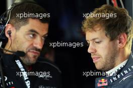(L to R): Guillaume Rocquelin (ITA) Red Bull Racing Race Engineer with Sebastian Vettel (GER) Red Bull Racing. 28.06.2013. Formula 1 World Championship, Rd 8, British Grand Prix, Silverstone, England, Practice Day.