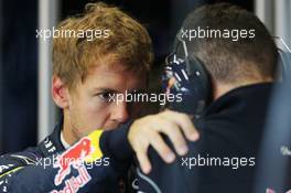 Sebastian Vettel (GER) Red Bull Racing with Guillaume Rocquelin (ITA) Red Bull Racing Race Engineer. 28.06.2013. Formula 1 World Championship, Rd 8, British Grand Prix, Silverstone, England, Practice Day.