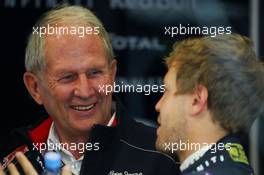 (L to R): Dr Helmut Marko (AUT) Red Bull Motorsport Consultant with Sebastian Vettel (GER) Red Bull Racing. 28.06.2013. Formula 1 World Championship, Rd 8, British Grand Prix, Silverstone, England, Practice Day.
