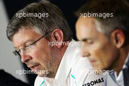 Ross Brawn (GBR) Mercedes AMG F1 Team Principal and Martin Whitmarsh (GBR) McLaren Chief Executive Officer in the FIA Press Conference. 28.06.2013. Formula 1 World Championship, Rd 8, British Grand Prix, Silverstone, England, Practice Day.