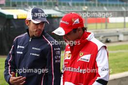 (L to R): Pastor Maldonado (VEN) Williams with Felipe Massa (BRA) Ferrari. 28.06.2013. Formula 1 World Championship, Rd 8, British Grand Prix, Silverstone, England, Practice Day.