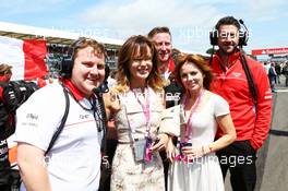 Amanda Holden (GBR) (Centre) and Geri Halliwell (GBR) Singer (Right) with Marussia F1 Team on the grid. 30.06.2013. Formula 1 World Championship, Rd 8, British Grand Prix, Silverstone, England, Race Day.
