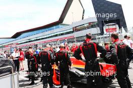 Marussia F1 Team on the grid. 30.06.2013. Formula 1 World Championship, Rd 8, British Grand Prix, Silverstone, England, Race Day.
