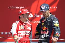 (L to R): Fernando Alonso (ESP) Ferrari with Mark Webber (AUS) Red Bull Racing on the podium. 30.06.2013. Formula 1 World Championship, Rd 8, British Grand Prix, Silverstone, England, Race Day.