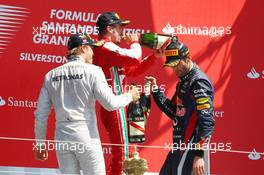 Race winner Nico Rosberg (GER) Mercedes AMG F1 celebrates on the podium with second placed Mark Webber (AUS) Red Bull Racing. 30.06.2013. Formula 1 World Championship, Rd 8, British Grand Prix, Silverstone, England, Race Day.