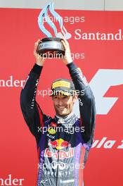 Mark Webber (AUS) Red Bull Racing celebrates his second position on the podium. 30.06.2013. Formula 1 World Championship, Rd 8, British Grand Prix, Silverstone, England, Race Day.