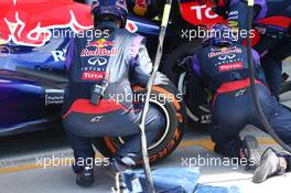 Tyres being fitting during a Red Bull Racing pit stop in the race mounted in the opposite direction. 30.06.2013. Formula 1 World Championship, Rd 8, British Grand Prix, Silverstone, England, Race Day.