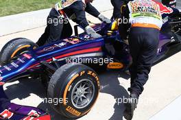 Right wheel mounted to the left hand side of the car can be noticed on Sebastian Vettel (GER) Red Bull Racing RB9 car being pushed back into the pit after retiring from the race.  30.06.2013. Formula 1 World Championship, Rd 8, British Grand Prix, Silverstone, England, Race Day.