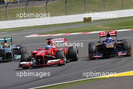 Fernando Alonso (ESP), Scuderia Ferrari and Daniel Ricciardo (AUS), Scuderia Toro Rosso  30.06.2013. Formula 1 World Championship, Rd 8, British Grand Prix, Silverstone, England, Race Day.