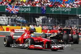 Felipe Massa (BRA) Ferrari F138 leads Kimi Raikkonen (FIN) Lotus F1 E21. 30.06.2013. Formula 1 World Championship, Rd 8, British Grand Prix, Silverstone, England, Race Day.