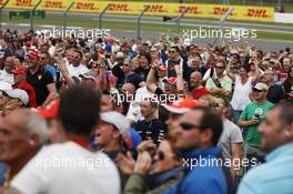 Fans celebrate as Lewis Hamilton (GBR) Mercedes AMG F1 takes pole position. 29.06.2013. Formula 1 World Championship, Rd 8, British Grand Prix, Silverstone, England, Qualifying Day.