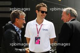 (L to R): Eddie Jordan (IRE) BBC Television Pundit with Tom Critchley (GBR) Aberdeen Asset Management and Ian Phillips (GBR). 29.06.2013. Formula 1 World Championship, Rd 8, British Grand Prix, Silverstone, England, Qualifying Day.