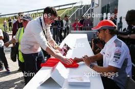 Jenson Button (GBR) McLaren signs autographs for the fans. 29.06.2013. Formula 1 World Championship, Rd 8, British Grand Prix, Silverstone, England, Qualifying Day.