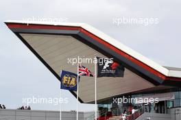 FIA, Union and F1 flags outside the Wing. 29.06.2013. Formula 1 World Championship, Rd 8, British Grand Prix, Silverstone, England, Qualifying Day.