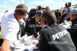 Lewis Hamilton (GBR) Mercedes AMG F1 signs autographs for the fans. 29.06.2013. Formula 1 World Championship, Rd 8, British Grand Prix, Silverstone, England, Qualifying Day.