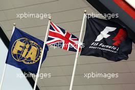 FIA, Union and F1 flags outside the Wing. 29.06.2013. Formula 1 World Championship, Rd 8, British Grand Prix, Silverstone, England, Qualifying Day.