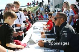 Lewis Hamilton (GBR) Mercedes AMG F1 signs autographs for the fans. 29.06.2013. Formula 1 World Championship, Rd 8, British Grand Prix, Silverstone, England, Qualifying Day.