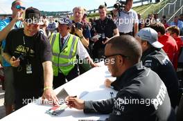 Lewis Hamilton (GBR) Mercedes AMG F1 signs autographs for the fans. 29.06.2013. Formula 1 World Championship, Rd 8, British Grand Prix, Silverstone, England, Qualifying Day.