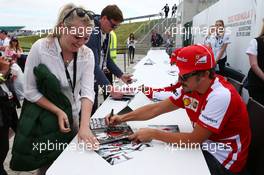 Fernando Alonso (ESP) Ferrari and Felipe Massa (BRA) Ferrari sign autographs for the fans. 29.06.2013. Formula 1 World Championship, Rd 8, British Grand Prix, Silverstone, England, Qualifying Day.