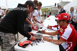 Fernando Alonso (ESP) Ferrari sign autographs for the fans. 29.06.2013. Formula 1 World Championship, Rd 8, British Grand Prix, Silverstone, England, Qualifying Day.