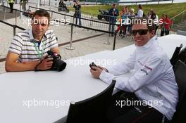 (L to R): Drew Gibson (GBR) Photographer with Will Hings (GBR) Sahara Force India F1 Press Officer. 29.06.2013. Formula 1 World Championship, Rd 8, British Grand Prix, Silverstone, England, Qualifying Day.