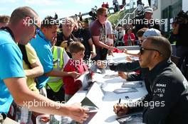 Lewis Hamilton (GBR) Mercedes AMG F1 signs autographs for the fans. 29.06.2013. Formula 1 World Championship, Rd 8, British Grand Prix, Silverstone, England, Qualifying Day.