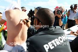 Lewis Hamilton (GBR) Mercedes AMG F1 signs autographs for the fans. 29.06.2013. Formula 1 World Championship, Rd 8, British Grand Prix, Silverstone, England, Qualifying Day.