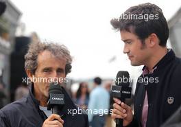 Alain Prost (FRA) and Thomas Senecal (FRA) Canal+ F1 Chief Editor and TV Presenter 29.06.2013. Formula 1 World Championship, Rd 8, British Grand Prix, Silverstone, England, Qualifying Day.