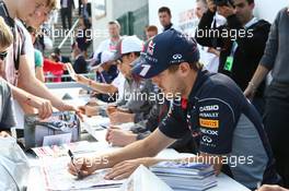 Sebastian Vettel (GER) Red Bull Racing signs autographs for the fans. 29.06.2013. Formula 1 World Championship, Rd 8, British Grand Prix, Silverstone, England, Qualifying Day.