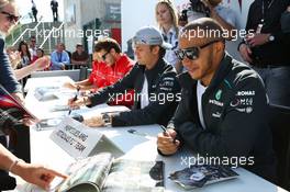 Lewis Hamilton (GBR) Mercedes AMG F1 signs autographs for the fans. 29.06.2013. Formula 1 World Championship, Rd 8, British Grand Prix, Silverstone, England, Qualifying Day.