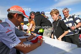 Jenson Button (GBR) McLaren signs autographs for the fans. 29.06.2013. Formula 1 World Championship, Rd 8, British Grand Prix, Silverstone, England, Qualifying Day.