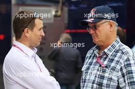 (L to R): Peter Phillips (GBR) with Alan Webber (AUS), father of Mark Webber (AUS) Red Bull Racing. 29.06.2013. Formula 1 World Championship, Rd 8, British Grand Prix, Silverstone, England, Qualifying Day.