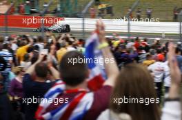 Fans celebrate as Lewis Hamilton (GBR) Mercedes AMG F1 W04 takes pole position. 29.06.2013. Formula 1 World Championship, Rd 8, British Grand Prix, Silverstone, England, Qualifying Day.