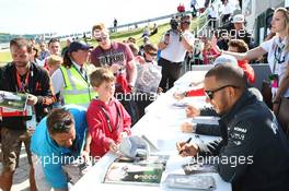 Lewis Hamilton (GBR) Mercedes AMG F1 signs autographs for the fans. 29.06.2013. Formula 1 World Championship, Rd 8, British Grand Prix, Silverstone, England, Qualifying Day.