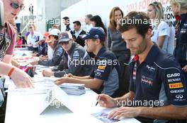 Mark Webber (AUS) Red Bull Racing signs autographs for the fans. 29.06.2013. Formula 1 World Championship, Rd 8, British Grand Prix, Silverstone, England, Qualifying Day.