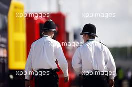 Police in the paddock. 30.06.2013. Formula 1 World Championship, Rd 8, British Grand Prix, Silverstone, England, Race Day.