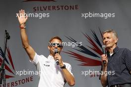 (L to R): Jenson Button (GBR) McLaren and Tony Jardine (GBR) at the post race concert. 30.06.2013. Formula 1 World Championship, Rd 8, British Grand Prix, Silverstone, England, Race Day.