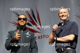 (L to R): Lewis Hamilton (GBR) Mercedes AMG F1 and Tony Jardine (GBR) at the post race concert. 30.06.2013. Formula 1 World Championship, Rd 8, British Grand Prix, Silverstone, England, Race Day.