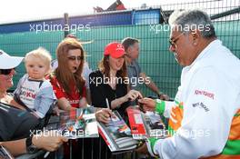 Dr. Vijay Mallya (IND) Sahara Force India F1 Team Owner signs autographs for the fans. 30.06.2013. Formula 1 World Championship, Rd 8, British Grand Prix, Silverstone, England, Race Day.