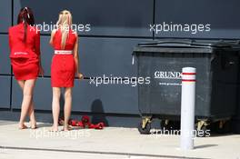 Grid girls take a break. 30.06.2013. Formula 1 World Championship, Rd 8, British Grand Prix, Silverstone, England, Race Day.