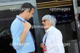 (L to R): Scott Piecha (GBR) Journalist with Bernie Ecclestone (GBR) CEO Formula One Group (FOM). British Grand Prix, Sunday 30th June 2013. Silverstone, England. 30.06.2013. Formula 1 World Championship, Rd 8, British Grand Prix, Silverstone, England, Race Day.