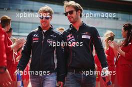 (L to R): Sebastian Vettel (GER) Red Bull Racing with Jean-Eric Vergne (FRA) Scuderia Toro Rosso STR8 on the drivers parade. 30.06.2013. Formula 1 World Championship, Rd 8, British Grand Prix, Silverstone, England, Race Day.