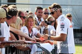 Jenson Button (GBR) McLaren signs autographs for the fans at the post race concert. 30.06.2013. Formula 1 World Championship, Rd 8, British Grand Prix, Silverstone, England, Race Day.