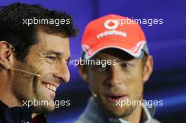 Mark Webber (AUS) Red Bull Racing and Jenson Button (GBR) McLaren in the FIA Press Conference. 27.06.2013. Formula 1 World Championship, Rd 8, British Grand Prix, Silverstone, England, Preparation Day.