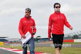 (L to R): Rodolfo Gonzalez (VEN) Marussia F1 Team Reserve Driver and Marc Hynes (GBR) Marussia F1 Team Driver Coach walk the circuit. 27.06.2013. Formula 1 World Championship, Rd 8, British Grand Prix, Silverstone, England, Preparation Day.