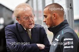 Lewis Hamilton (GBR) Mercedes AMG F1 with Sir David Frost (GBR) Broadcaster. 27.06.2013. Formula 1 World Championship, Rd 8, British Grand Prix, Silverstone, England, Preparation Day.