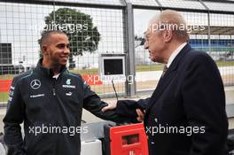 Lewis Hamilton (GBR) Mercedes AMG F1 with Sir David Frost (GBR) Broadcaster. 27.06.2013. Formula 1 World Championship, Rd 8, British Grand Prix, Silverstone, England, Preparation Day.