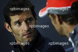 (L to R): Mark Webber (AUS) Red Bull Racing and Jenson Button (GBR) McLaren in the FIA Press Conference. 27.06.2013. Formula 1 World Championship, Rd 8, British Grand Prix, Silverstone, England, Preparation Day.
